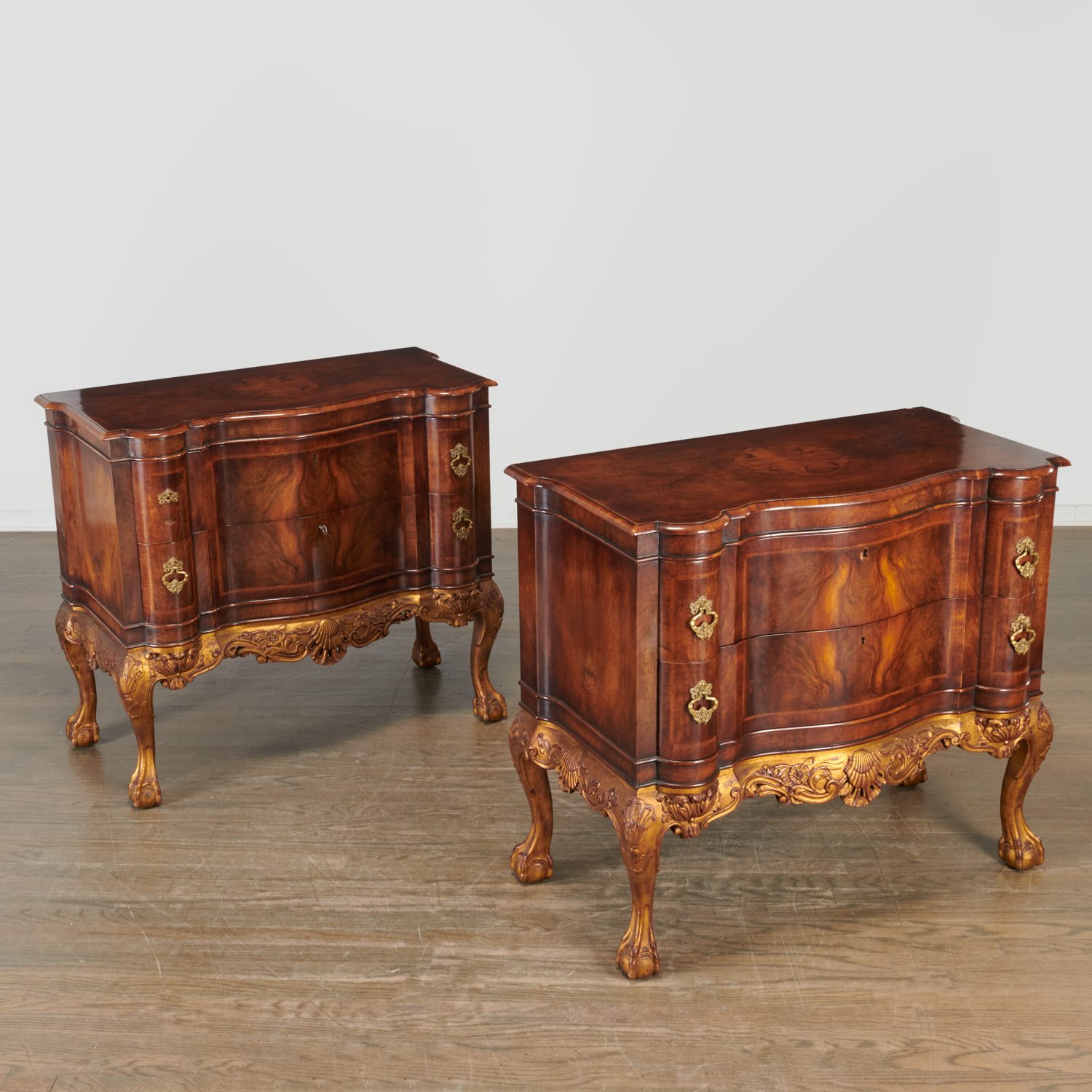 Appraisal: PAIR PORTUGUESE ROCOCO STYLE SERPENTINE COMMODES th c figured mahogany