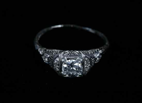 Appraisal: EDWARDIAN PLATINUM AND DIAMOND RING Round diamond weighing approximately ct