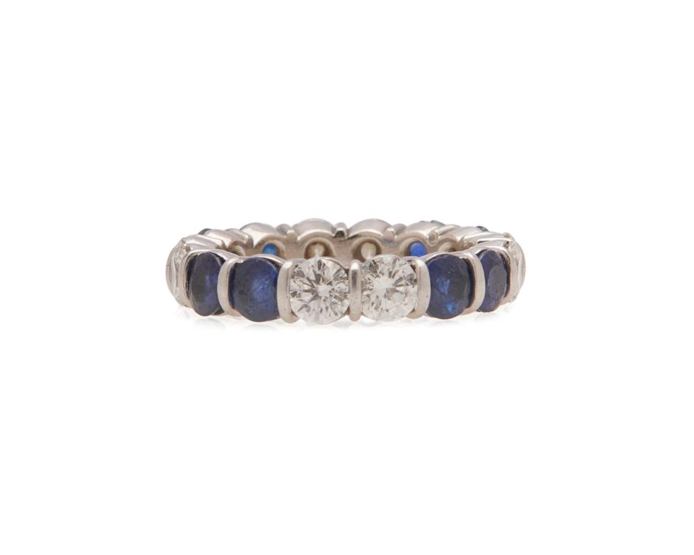 Appraisal: Platinum Diamond and Sapphire Eternity Band featuring alternating groupings of