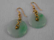 Appraisal: A pair of jade disc earrings with yellow metal tests