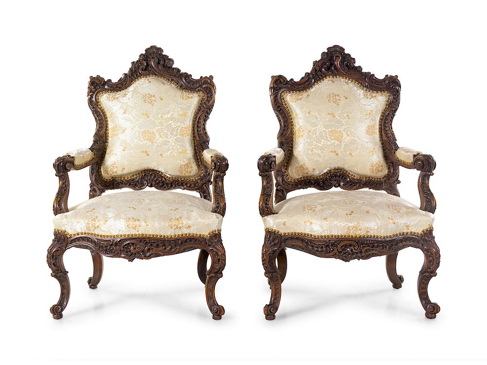 Appraisal: A Pair of Rococo Revival Carved Walnut Fauteuils A Pair