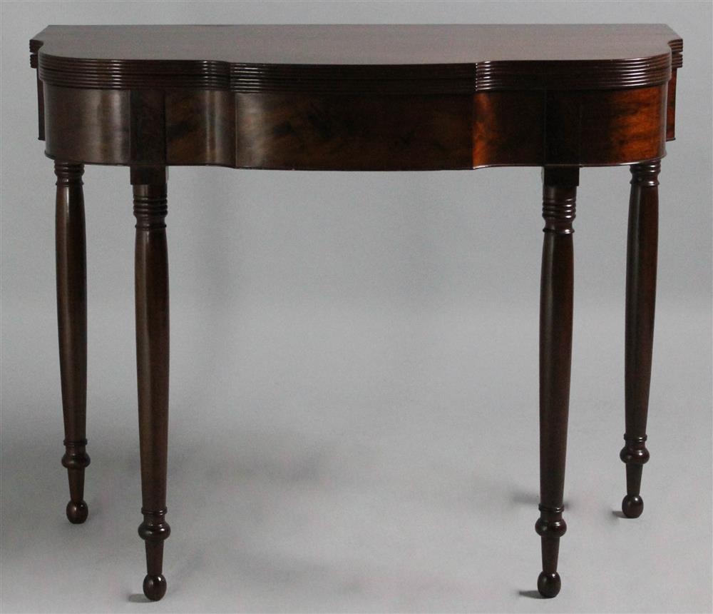 Appraisal: FEDERAL MAHOGANY CARD TABLE the oblong serpentine hinged top with