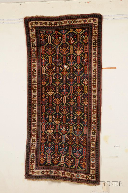 Appraisal: Northwest Persian Rug early th century two holes ft in