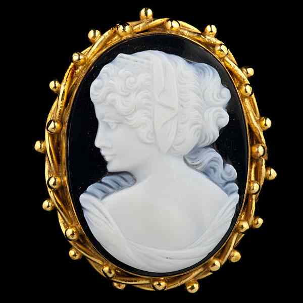 Appraisal: Onyx and Stone Cameo A black onyx brooch with white