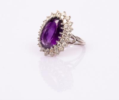 Appraisal: An amethyst and diamond oval cluster ring the amethyst with