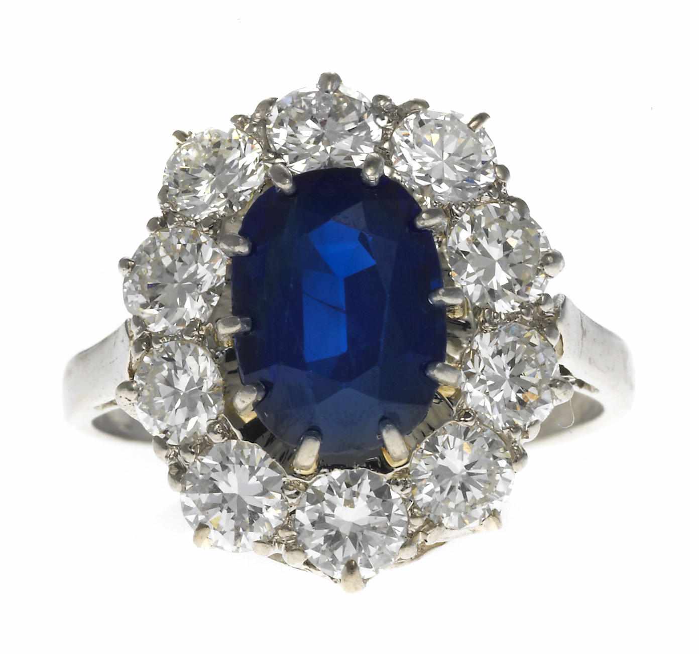 Appraisal: A sapphire and diamond ring cushion-cut sapphire weighing approximately carats