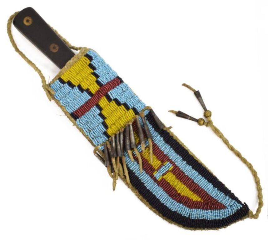 Appraisal: Replica Sioux-style beaded knife sheath contemporary accented with tin cones