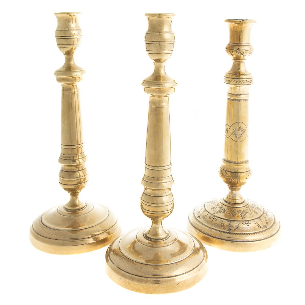 Appraisal: Three French Brass Candlesticks th century circular base candlestick with