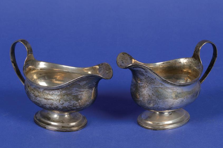 Appraisal: A MATCHED PAIR OF SAUCEBOATS of oval form with plain