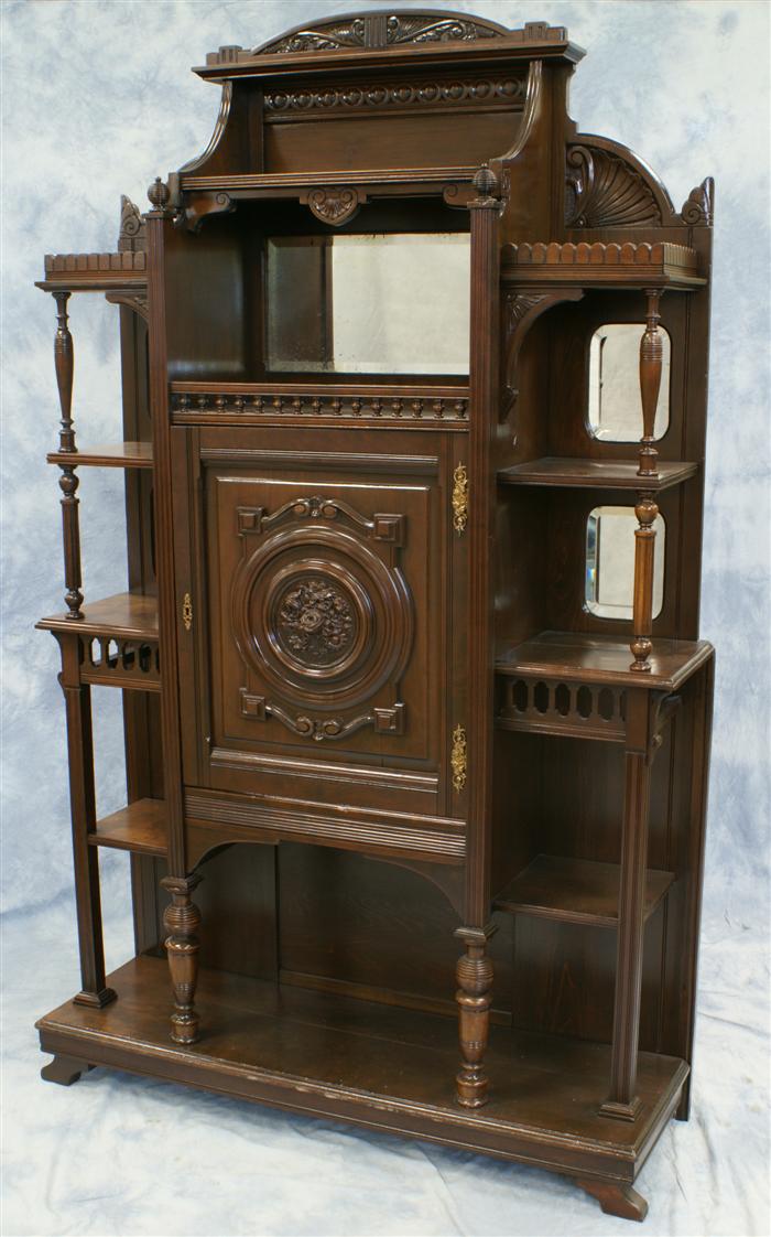 Appraisal: Carved mahogany Victorian Eastlake etagere beveled mirrors cupboard comaprtment h