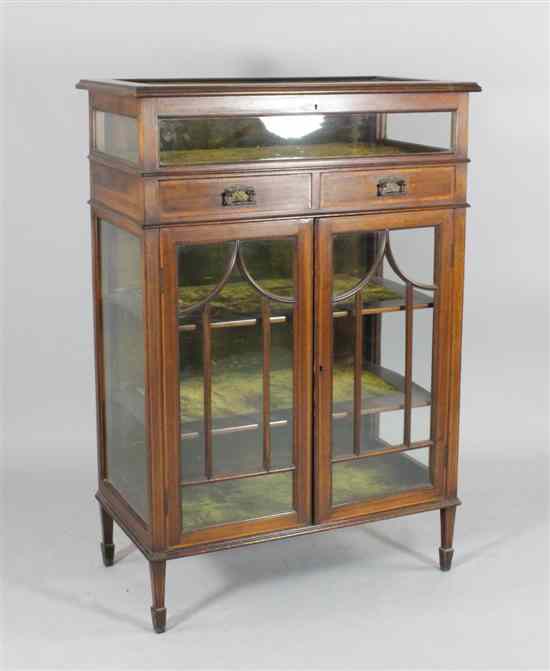 Appraisal: An Edwardian inlaid mahogany bijouterie cabinet with two drawers and