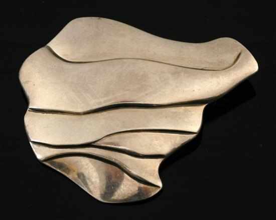 Appraisal: A brooch by Georg Jensen Designed by Ole Kortzau of