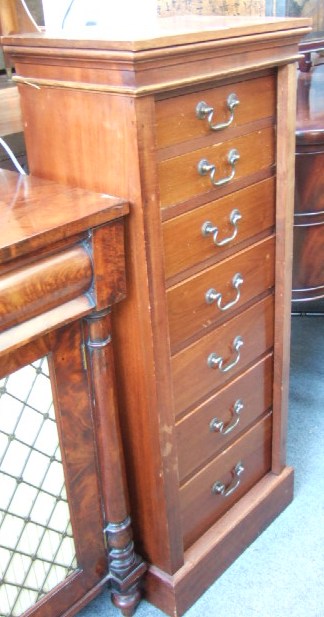 Appraisal: A late Victorian mahogany Wellington chest with a plain frieze