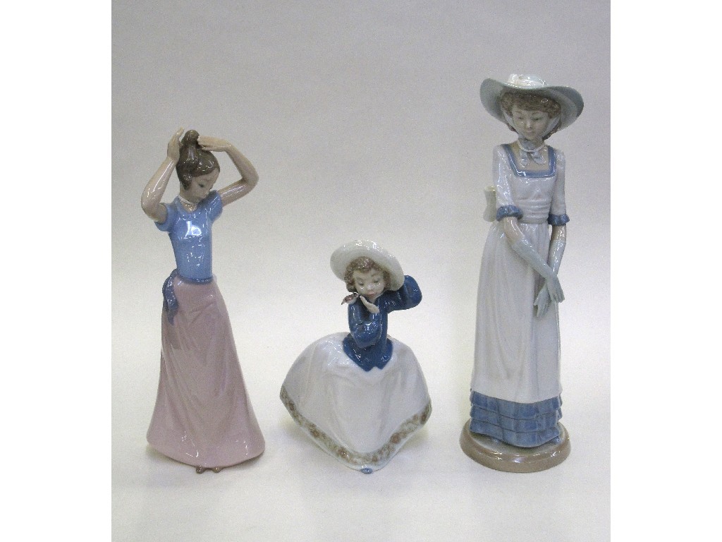 Appraisal: Three Nao figures of young girls