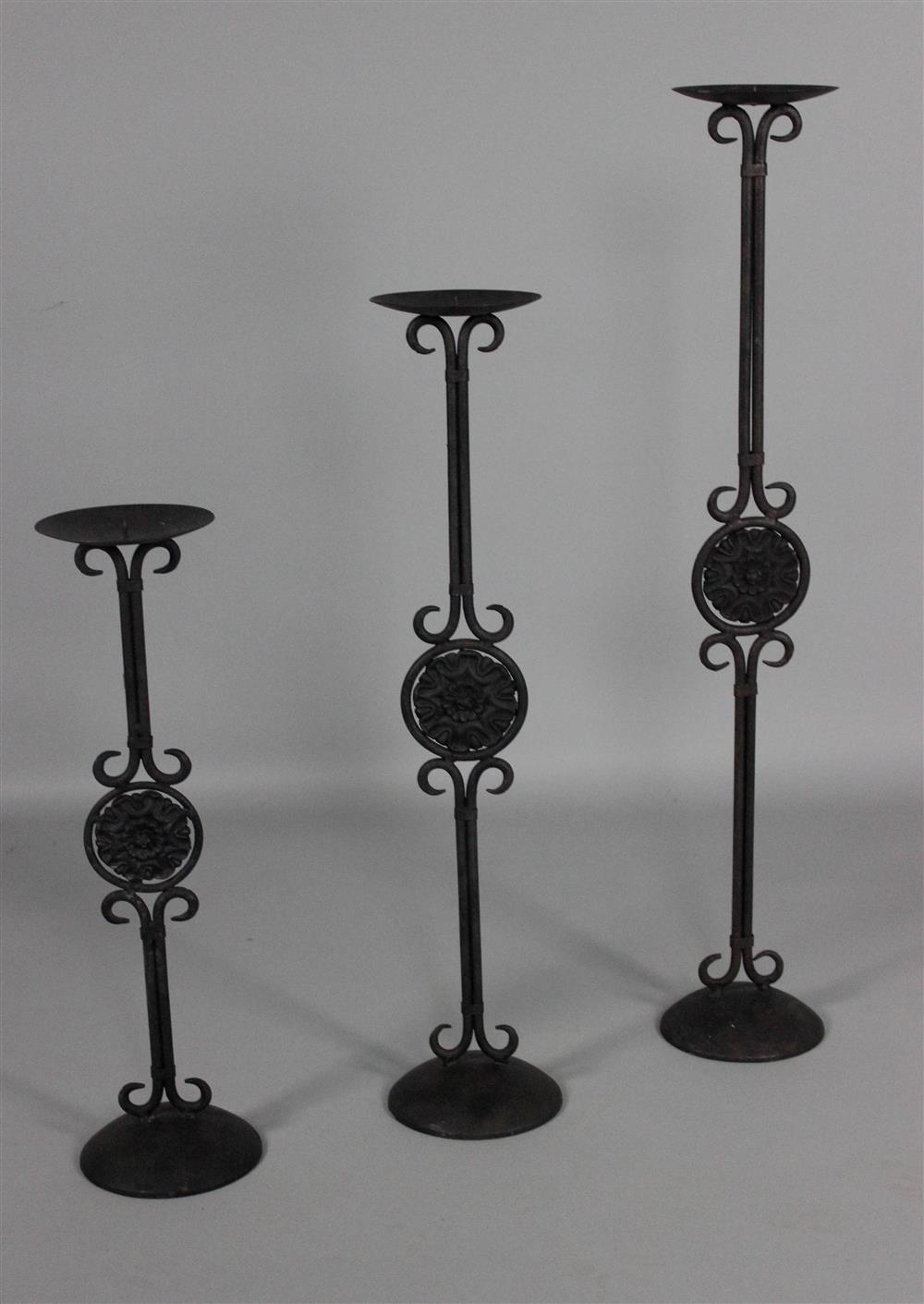 Appraisal: SET OF THREE GRADUATED CAST IRON PRICKET STICKS ESTATE OF