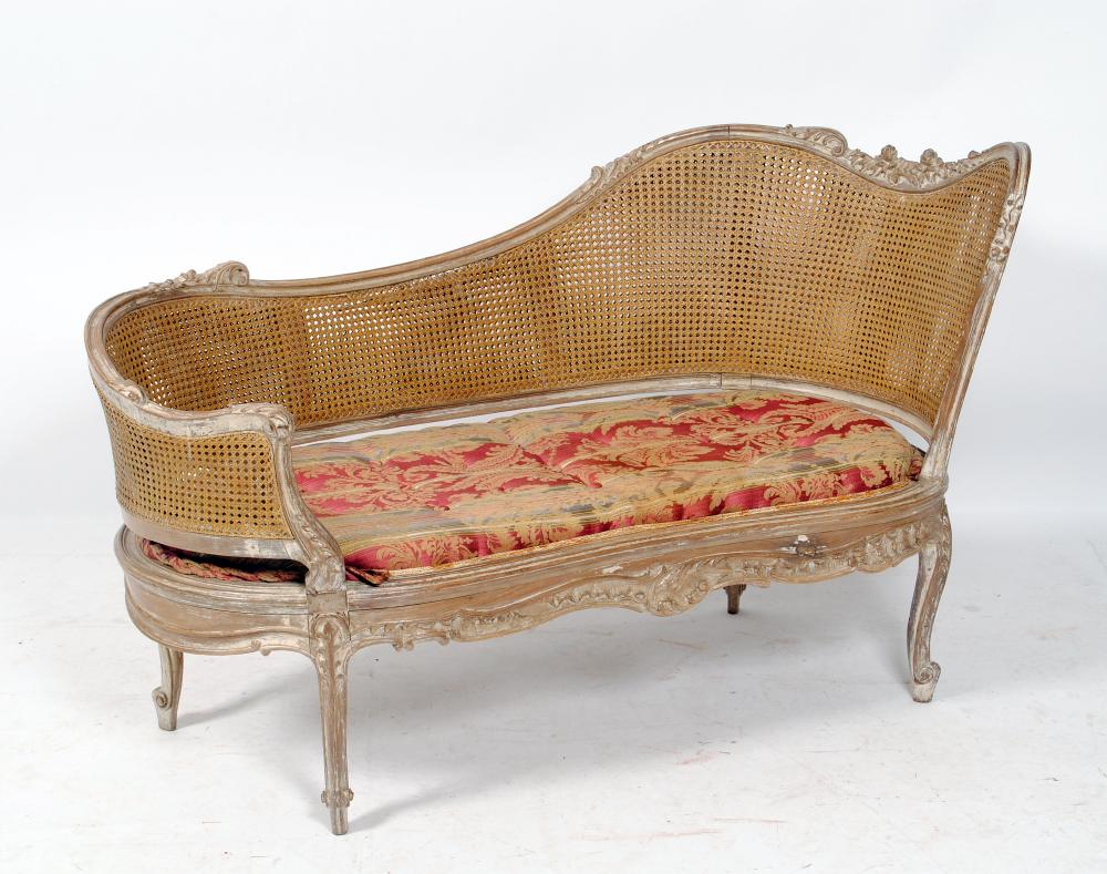 Appraisal: A CANED AND BEECH CANAPE in the Louis XV style