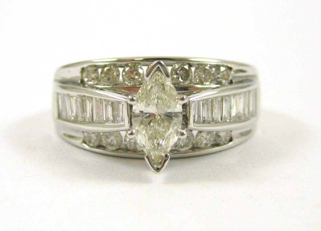 Appraisal: DIAMOND AND FOURTEEN KARAT WHITE GOLD RING channel set with