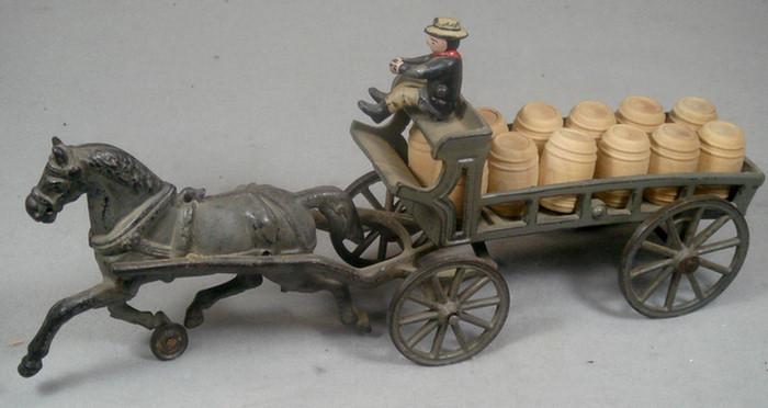 Appraisal: Cast iron toy horse drawn carriage with removable driver cargo