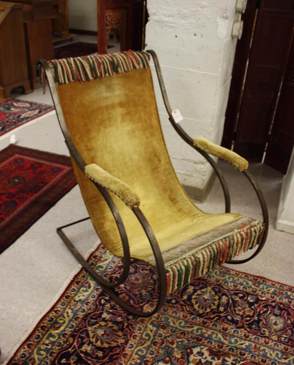 Appraisal: STEEL FRAMED SLING ROCKING CHAIR after a design by Peter