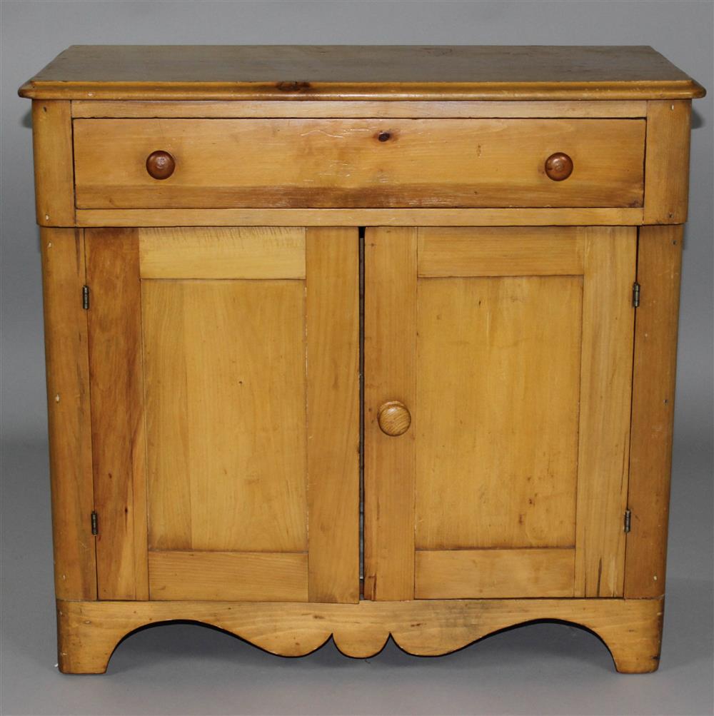 Appraisal: STAINED PINE CABINET with a rectangular molded top over a