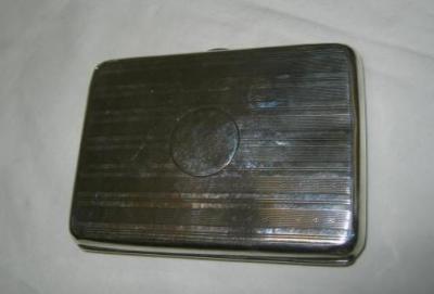 Appraisal: A CARD CASE of rounded oblong form with engine turned