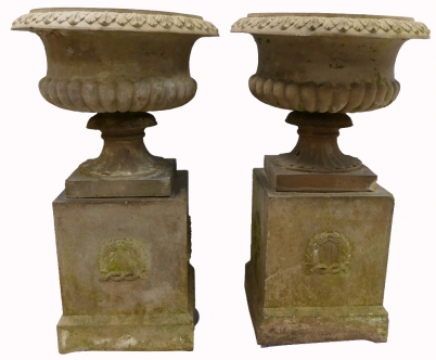 Appraisal: A pair of quality cast stone urns on bases overall