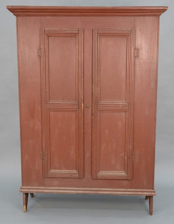 Appraisal: Primitive cupboard with two doors having bootjack ends height in