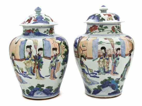 Appraisal: A Pair of Wucai Decorated Lidded Porcelain Baluster Vases with