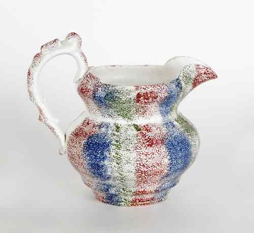 Appraisal: Red blue and green rainbow spatter pitcher th c h