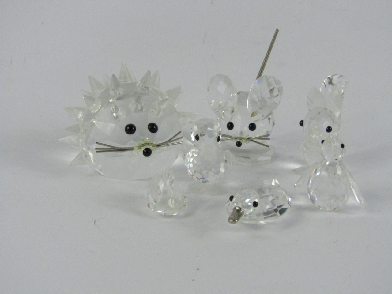 Appraisal: Swarovski crystal animals and birds comprising hedgehog squirrel mouse penguin