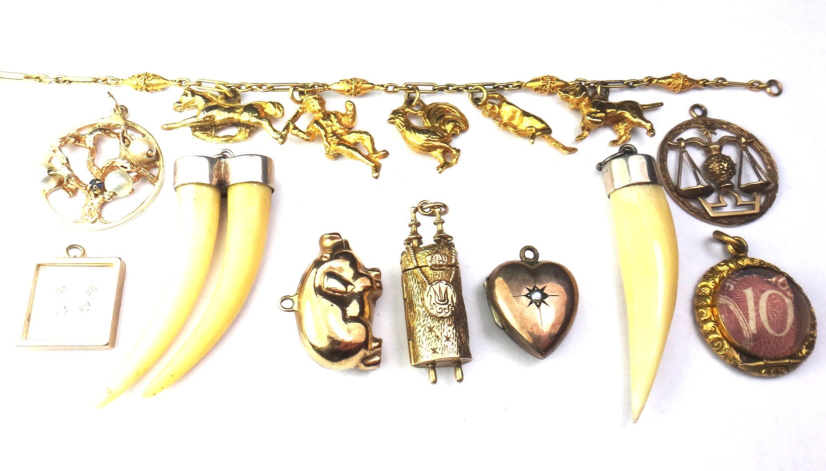 Appraisal: A ct gold Libra pendant eight further pendants and charms