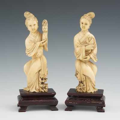 Appraisal: A Pair of Chinese Carved Ivory Maidens on Wood Stands