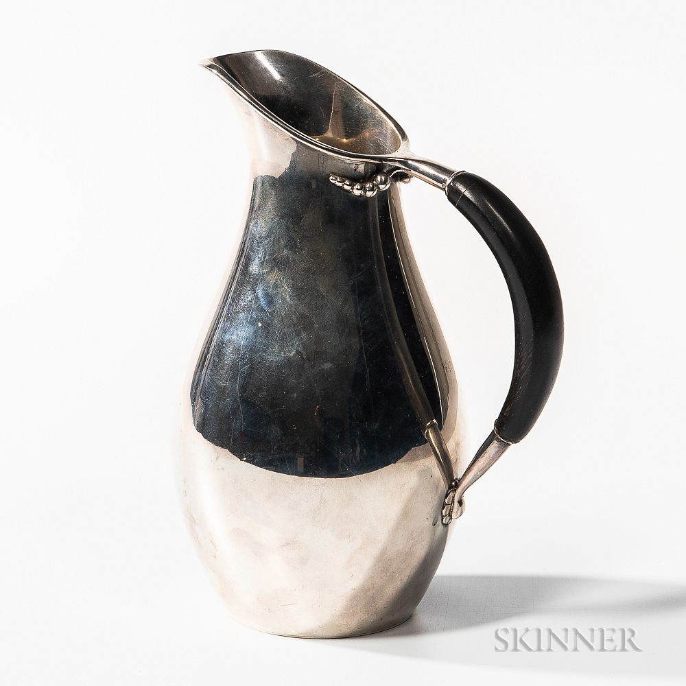 Appraisal: Jensen-style Sterling Silver Pitcher Jensen-style Sterling Silver Pitcher mid to