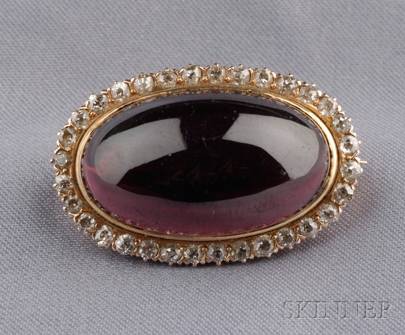 Appraisal: Antique Garnet and Diamond Brooch bezel-set with an oval carbuncle