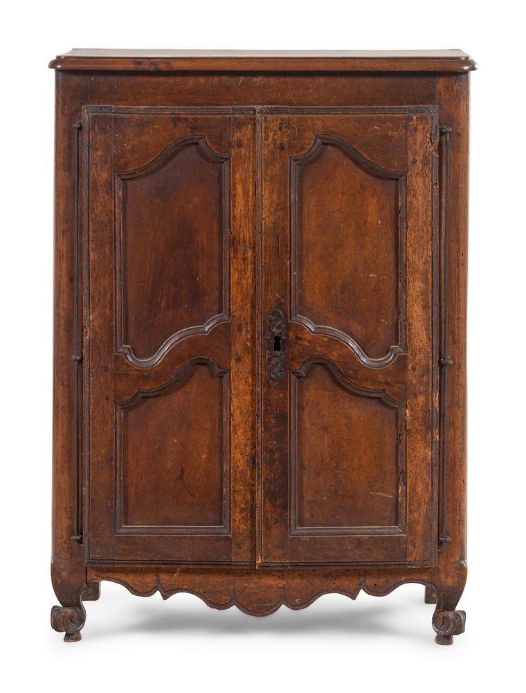 Appraisal: A French Provincial Carved Walnut Diminutive Armoire A French Provincial