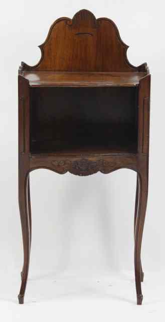 Appraisal: A bedside table with carved back and pierced hearts to