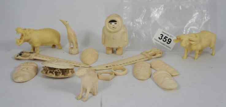 Appraisal: Old Ivory Items including Two Elephant Letter Knives Carved Animal