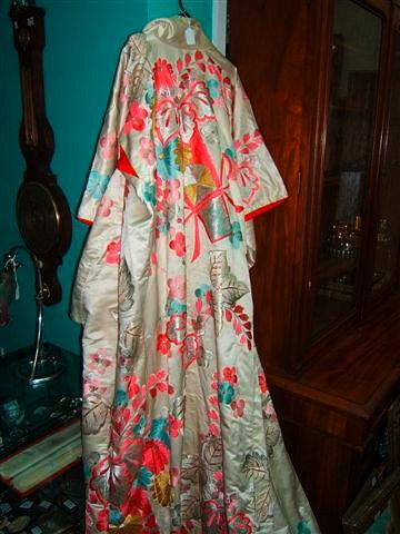 Appraisal: A Japanese cream silk kimono embroidered with flowers and with