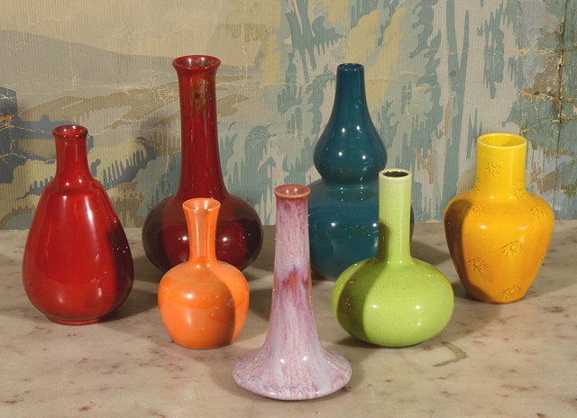 Appraisal: A GROUP OF VARIOUSLY COLOURED SMALL ART POTTERY VASES by