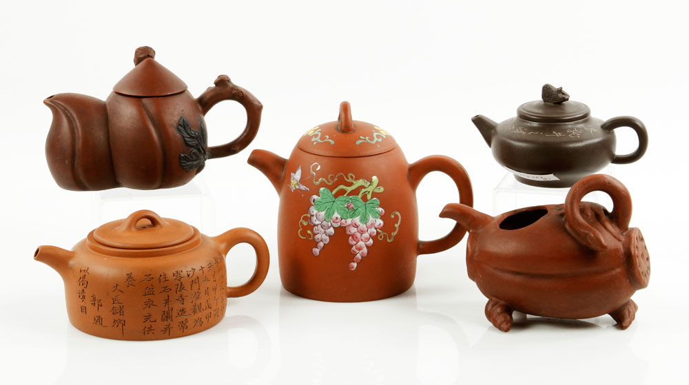 Appraisal: - Five Carved Yixing Teapots Five carved Yixing teapots China