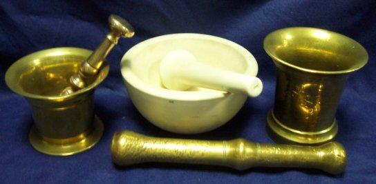 Appraisal: A brass pestle and mortar the mortar stamped cm high