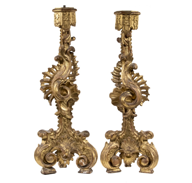 Appraisal: PR CARVED ITALIAN GILTWOOD CANDLESTICKS Pair of th c Rococo