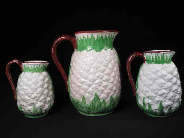 Appraisal: Three Majolica pottery pitchers graduated sizes in the white pineapple