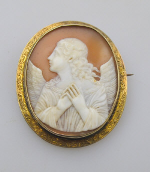 Appraisal: Oval shell cameo brooch of angel with clasped hands within