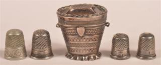 Appraisal: th Century Silver Thimble Case and Four Various Thimbles Case