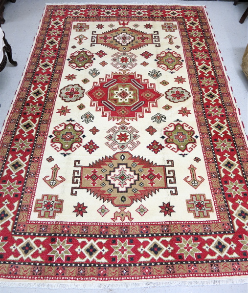 Appraisal: HAND KNOTTED ORIENTAL CARPET Indo-Kazak overall geometric and curvilinear decoration