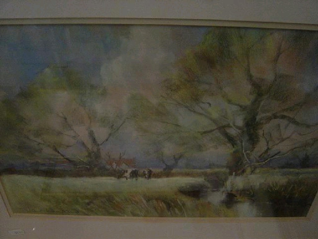 Appraisal: A pastel drawing of a country landscape with cattle grazing