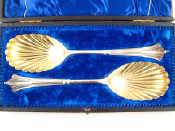 Appraisal: A pair of silver Albany pattern serving spoons with shell