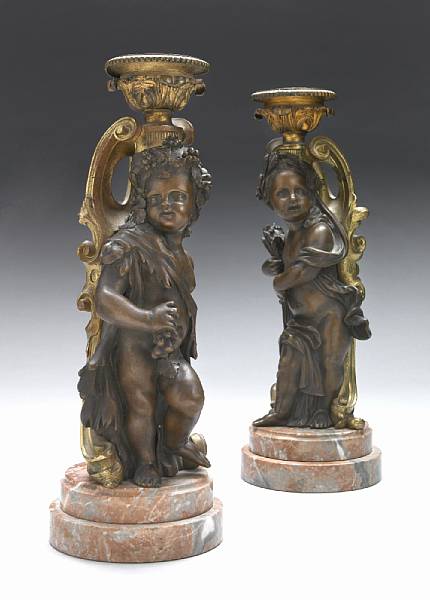 Appraisal: A pair of French gilt and patinated bronze figural lamps