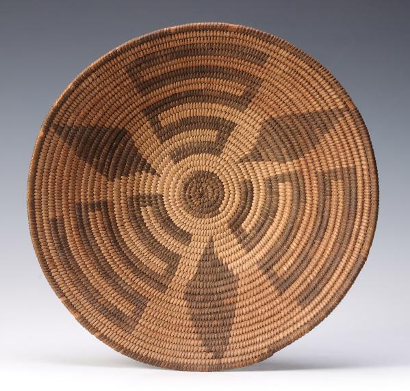 Appraisal: A PIMA INDIAN BASKETRY TRAYThe visually striking design in devil's